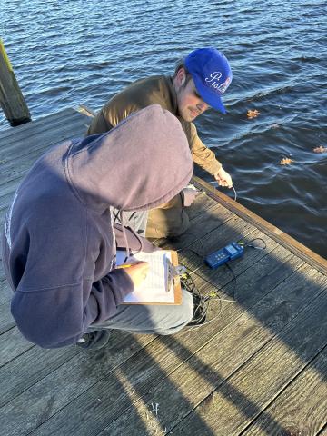 Students collect water data off dock